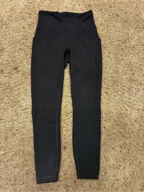 Lululemon size 6 tights with side pockets